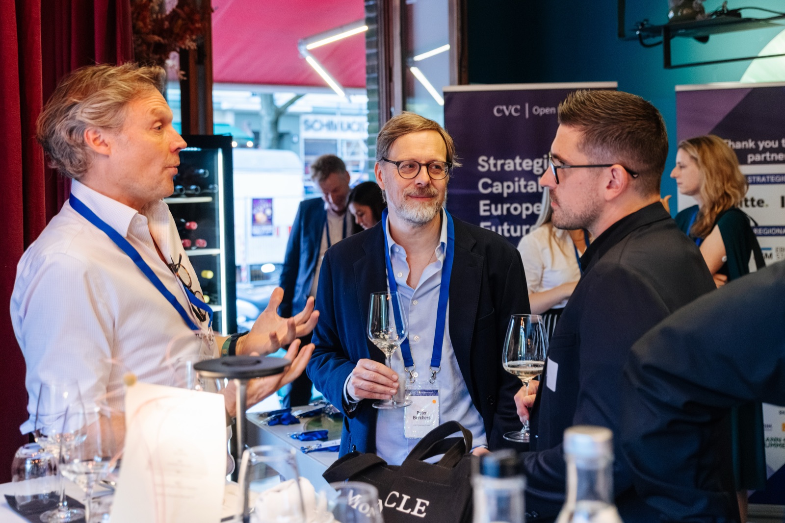 Participants in conversation at the evening reception