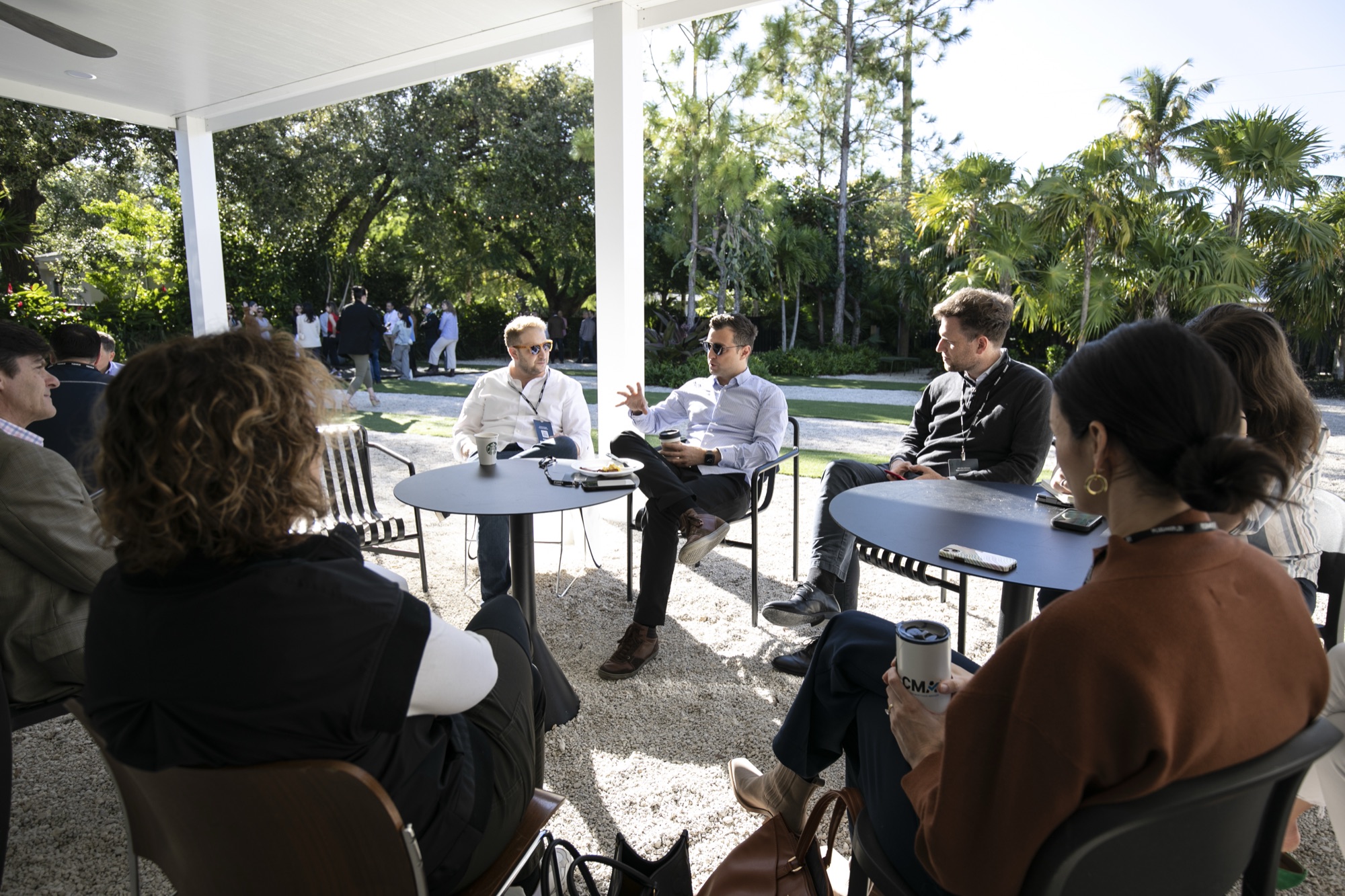 Participants talking outdoors between sessions