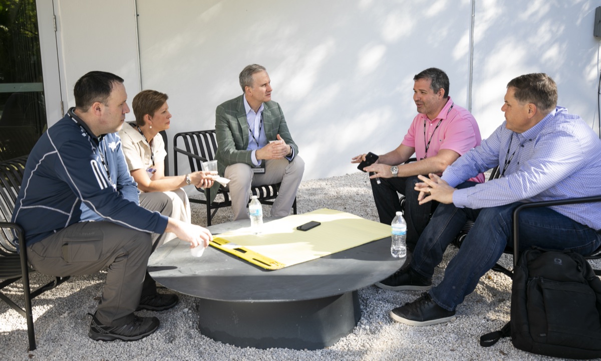 A working group around a table outdoors
