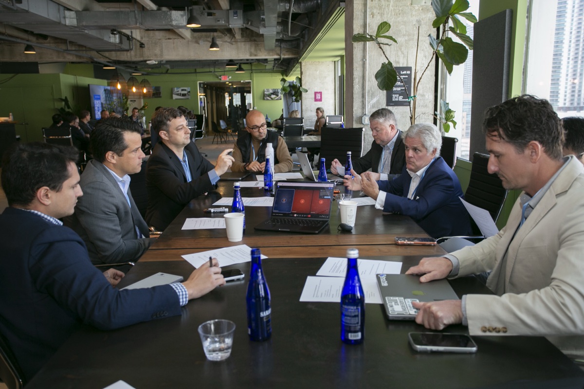 Participants in a working session around a table