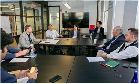 Participants in a small-group working session around a table
